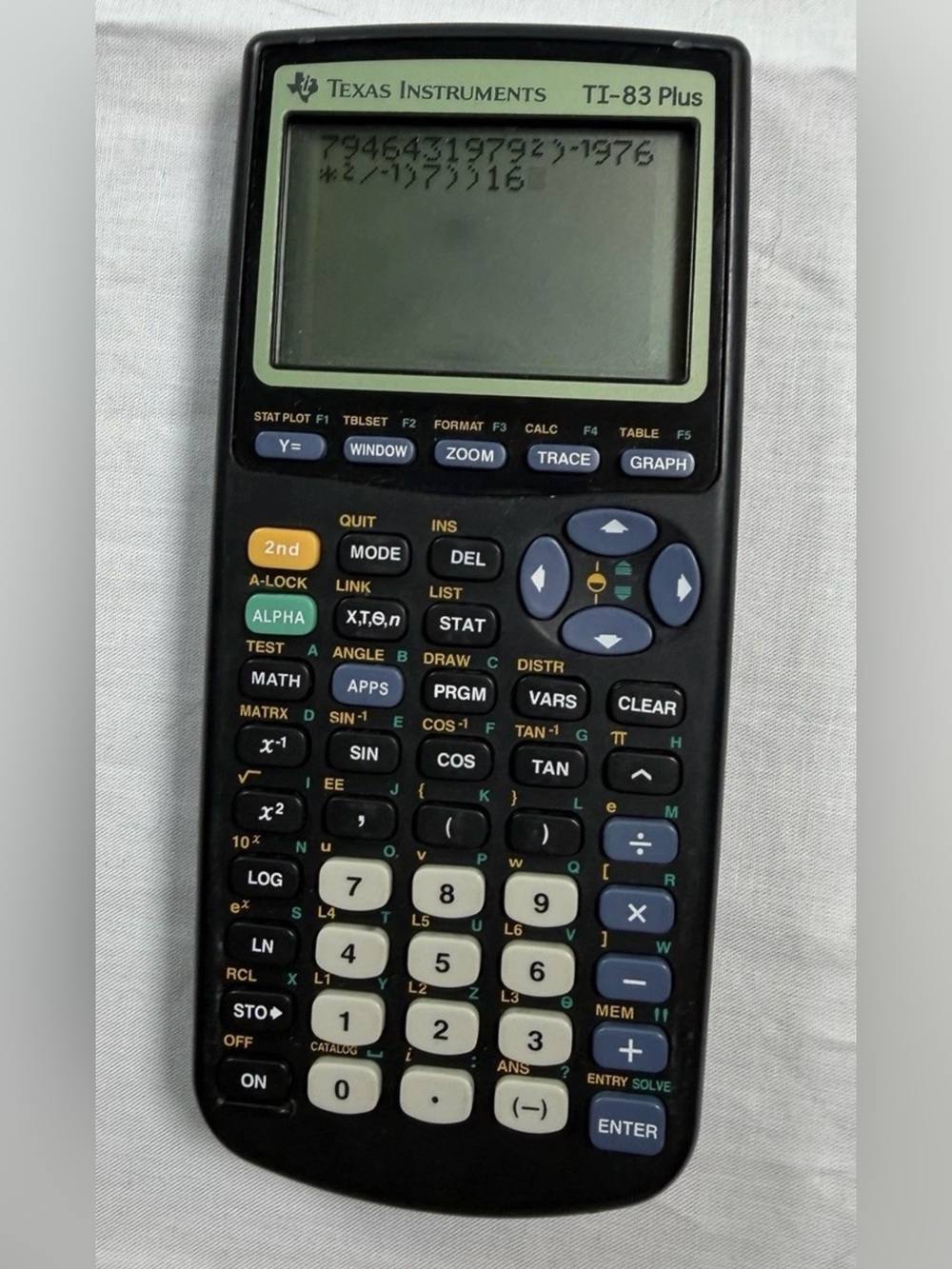 Texas Instruments TI-83 Plus Black Graphing Calculator with Green Accent